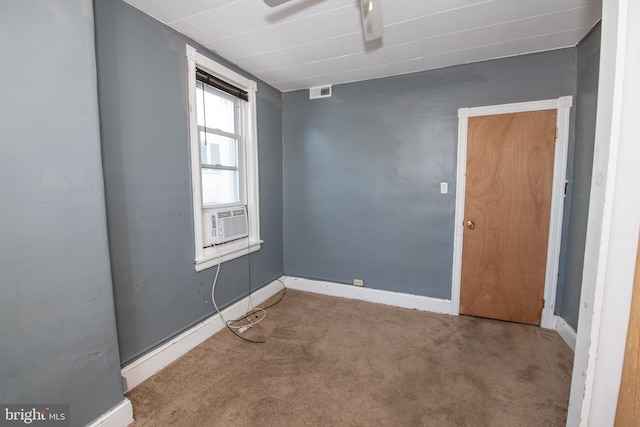 spare room with carpet floors and cooling unit