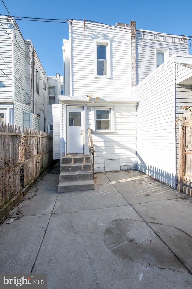 rear view of property featuring a patio