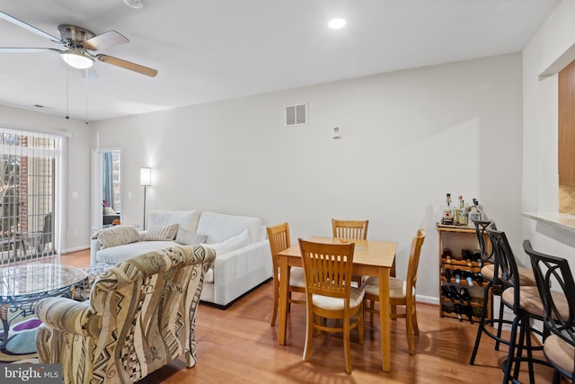 dining area featuring ceiling fan and light hardwood / wood-style floors