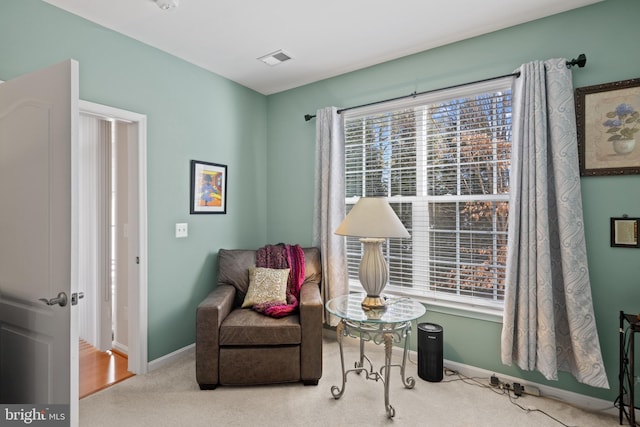 sitting room with carpet floors