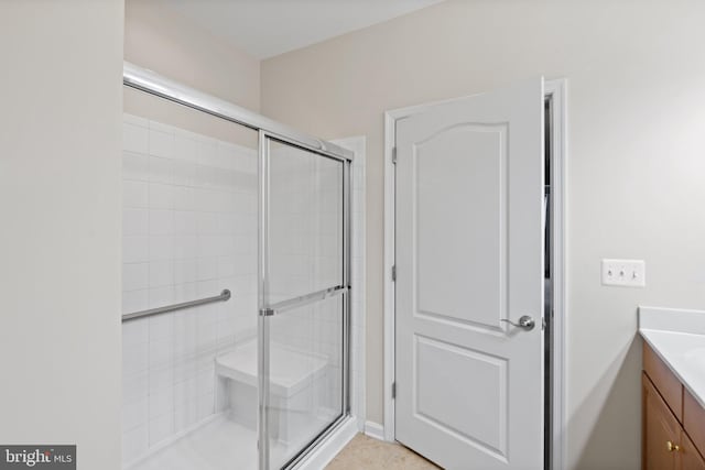 bathroom with vanity and an enclosed shower