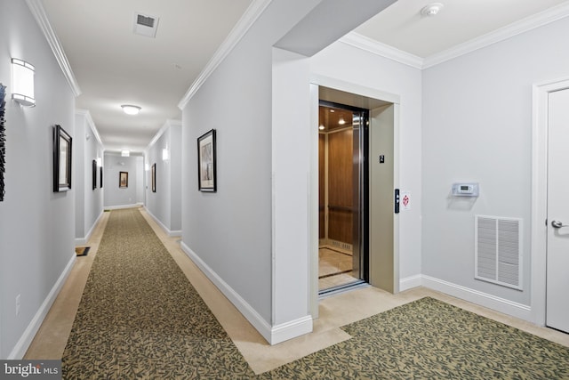 corridor with ornamental molding, elevator, and light colored carpet