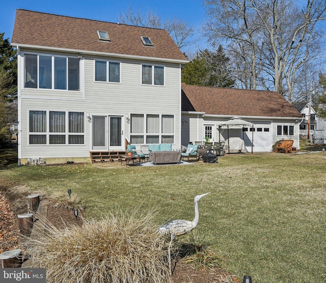 rear view of property with a shingled roof, entry steps, outdoor lounge area, and a lawn