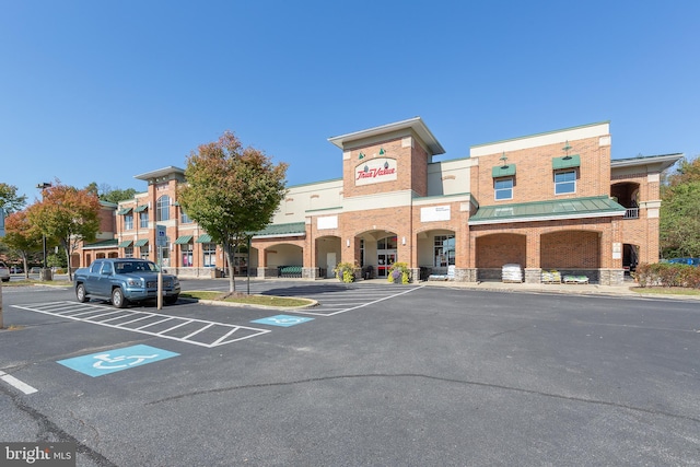 view of property featuring uncovered parking