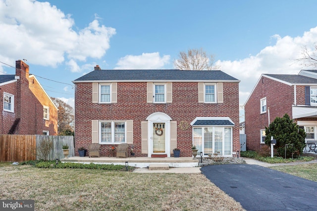 view of front of property with a patio area and a front yard