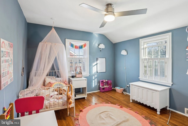 bedroom with hardwood / wood-style flooring, ceiling fan, and lofted ceiling