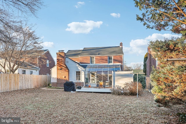 back of property with an outbuilding