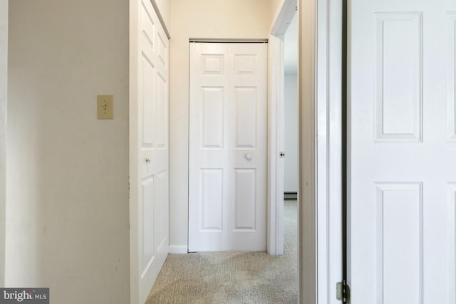 corridor with light colored carpet