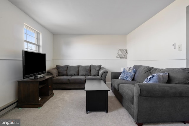 carpeted living room with a baseboard radiator