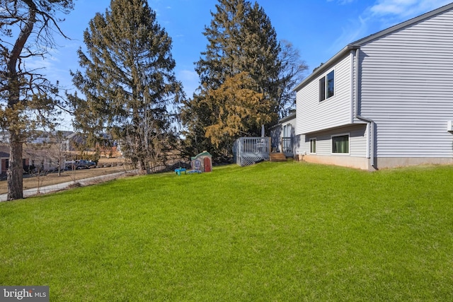 view of yard featuring a wooden deck