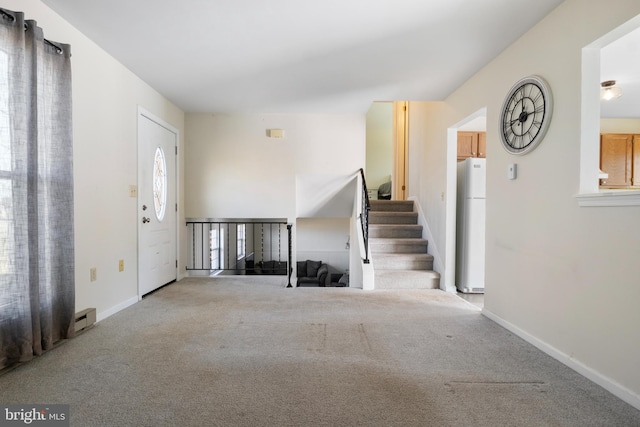 view of carpeted foyer