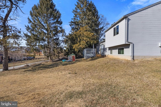 view of yard featuring a wooden deck