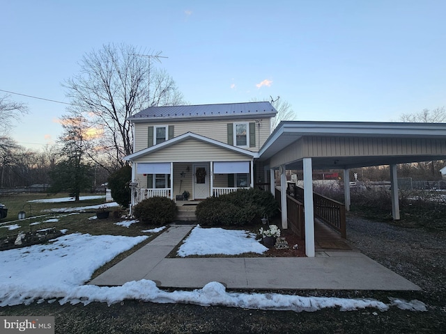 view of front of property featuring a porch and metal roof