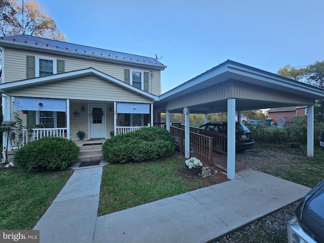 view of front of property with covered porch, metal roof, and a standing seam roof