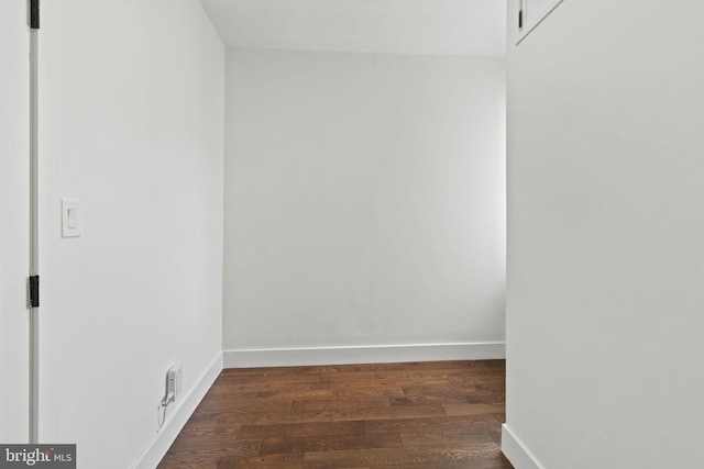 empty room featuring dark wood-type flooring