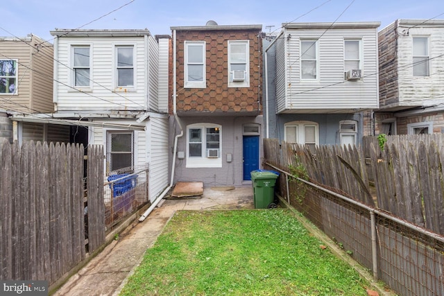 rear view of house featuring cooling unit