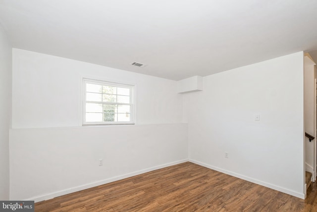 unfurnished room featuring hardwood / wood-style floors