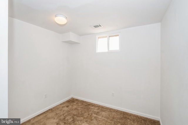 empty room with carpet flooring