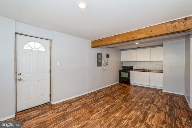 foyer entrance featuring beam ceiling, sink, electric panel, and dark hardwood / wood-style flooring