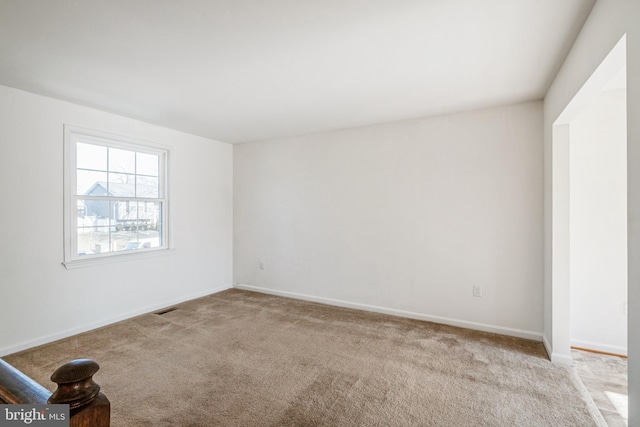 spare room with light colored carpet