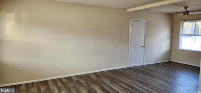 empty room featuring dark hardwood / wood-style flooring, ceiling fan, and beamed ceiling