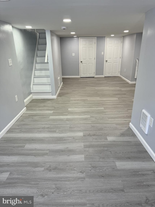 basement with light wood-type flooring