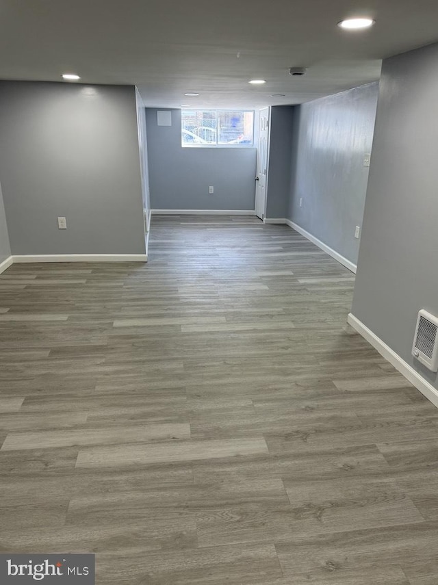 basement featuring light hardwood / wood-style floors