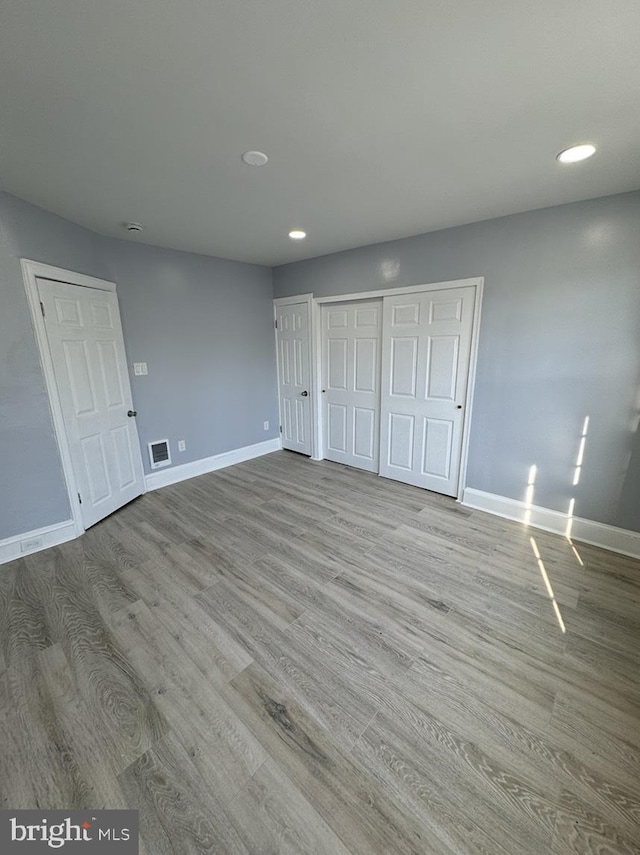 unfurnished bedroom with light hardwood / wood-style floors