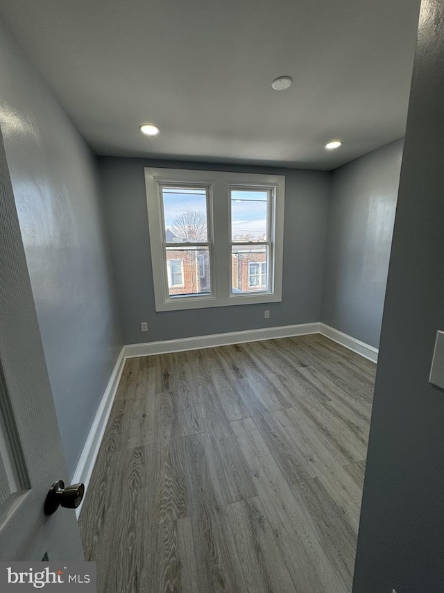 unfurnished room featuring wood-type flooring