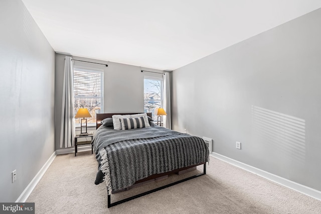 bedroom featuring light colored carpet