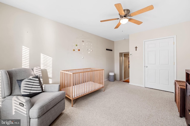 carpeted bedroom with ceiling fan