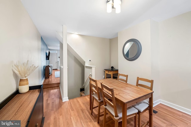 dining area with light hardwood / wood-style flooring