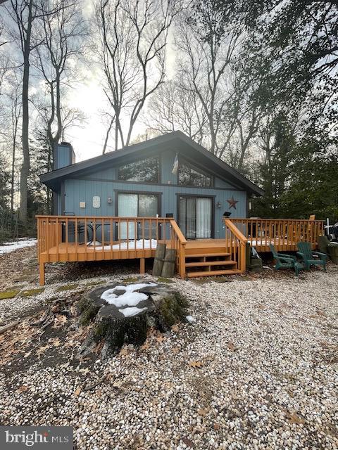 rear view of property with a deck