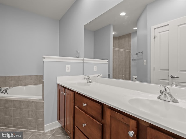 bathroom featuring tile patterned floors, shower with separate bathtub, and vanity