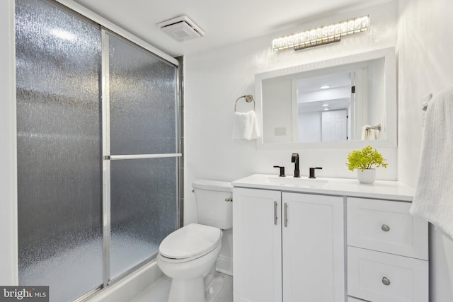 full bathroom featuring visible vents, a stall shower, vanity, and toilet