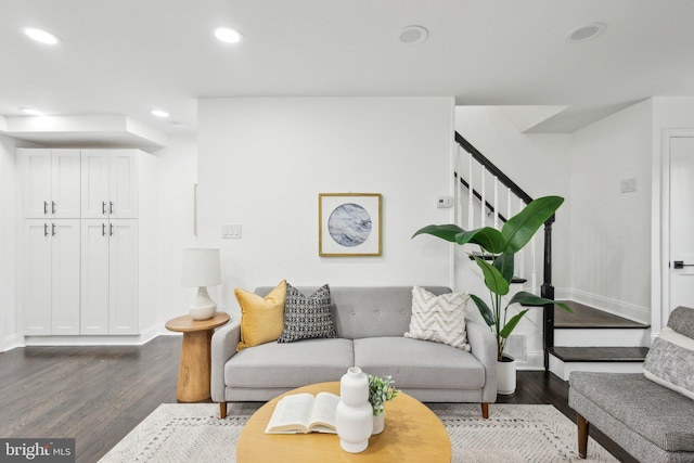 living room with stairs, baseboards, dark wood-type flooring, and recessed lighting