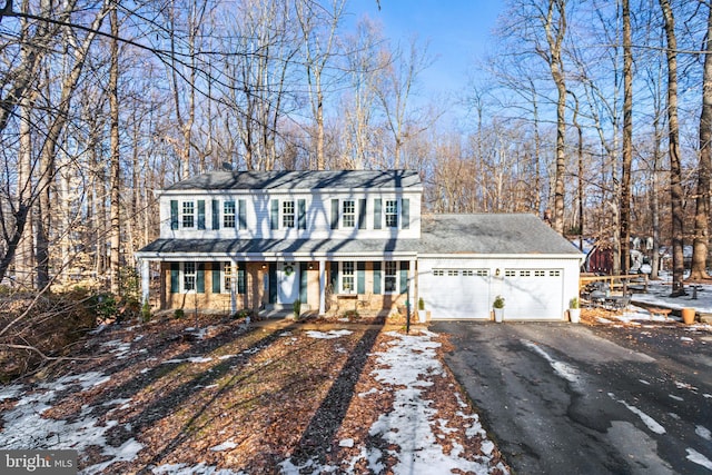 view of front of house with a garage and covered porch