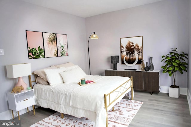 bedroom featuring hardwood / wood-style flooring