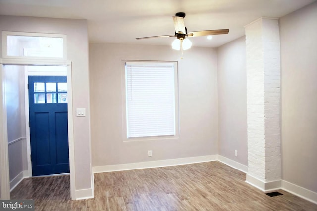 foyer with hardwood / wood-style flooring and ceiling fan