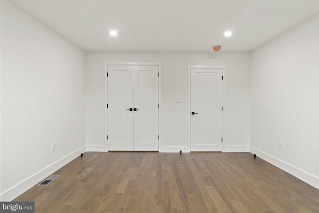 unfurnished bedroom featuring wood-type flooring