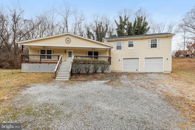 view of front facade with a garage and a porch