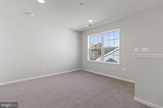 unfurnished room with carpet