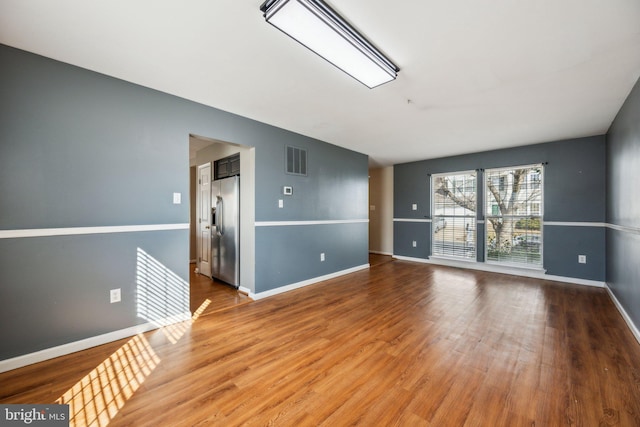 unfurnished room featuring hardwood / wood-style floors