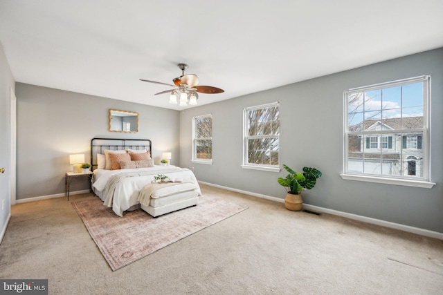 bedroom with ceiling fan and light colored carpet