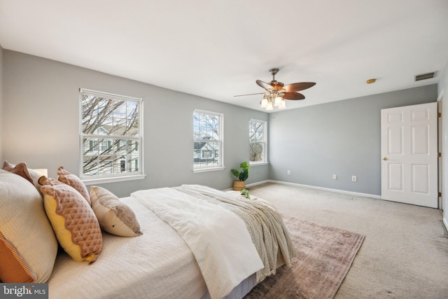 bedroom with ceiling fan and carpet floors