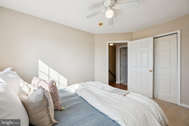 carpeted bedroom featuring ceiling fan