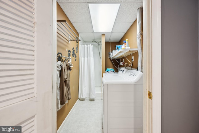 laundry area featuring washing machine and clothes dryer