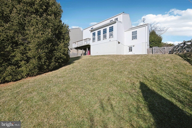 rear view of property with a lawn