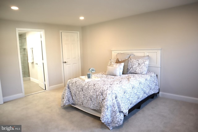 carpeted bedroom with connected bathroom