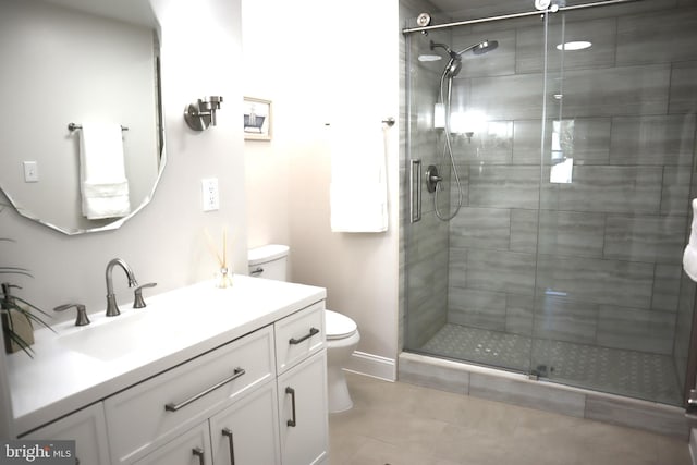 bathroom featuring vanity, toilet, and an enclosed shower